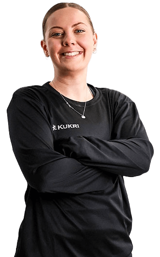Meg Perry posing with her arms folded