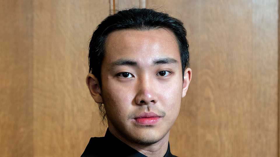 Young male of Chinese heritage with short black hair