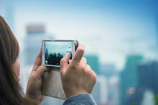 Someone taking a photo using a smartphones.