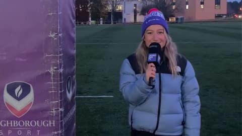 Bella Harris-Johnstone standing outside on a sports pitch with a microphones.