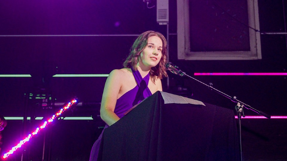 Daisy Newton, Industrial Design student, speaking through a microphones
