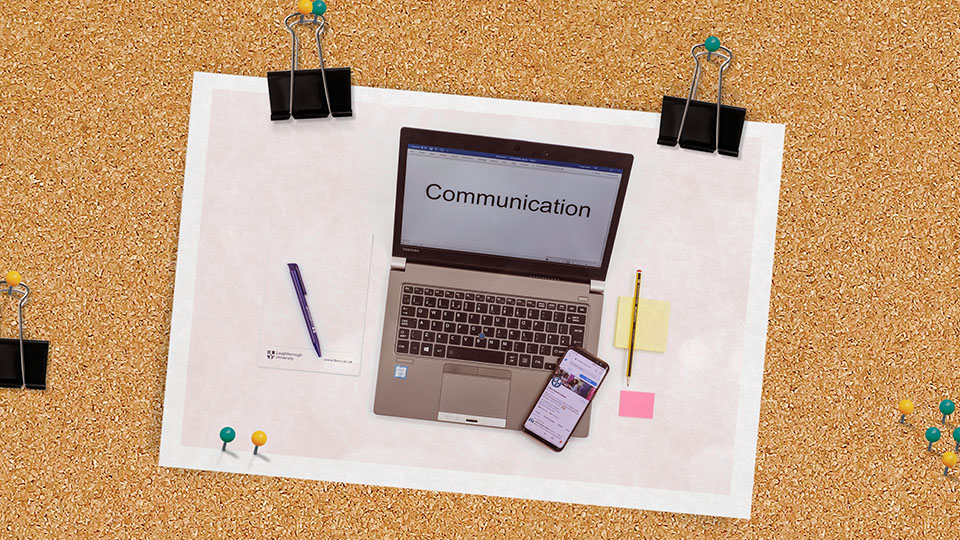photo of laptop and mobiles phones clipped to a notice board