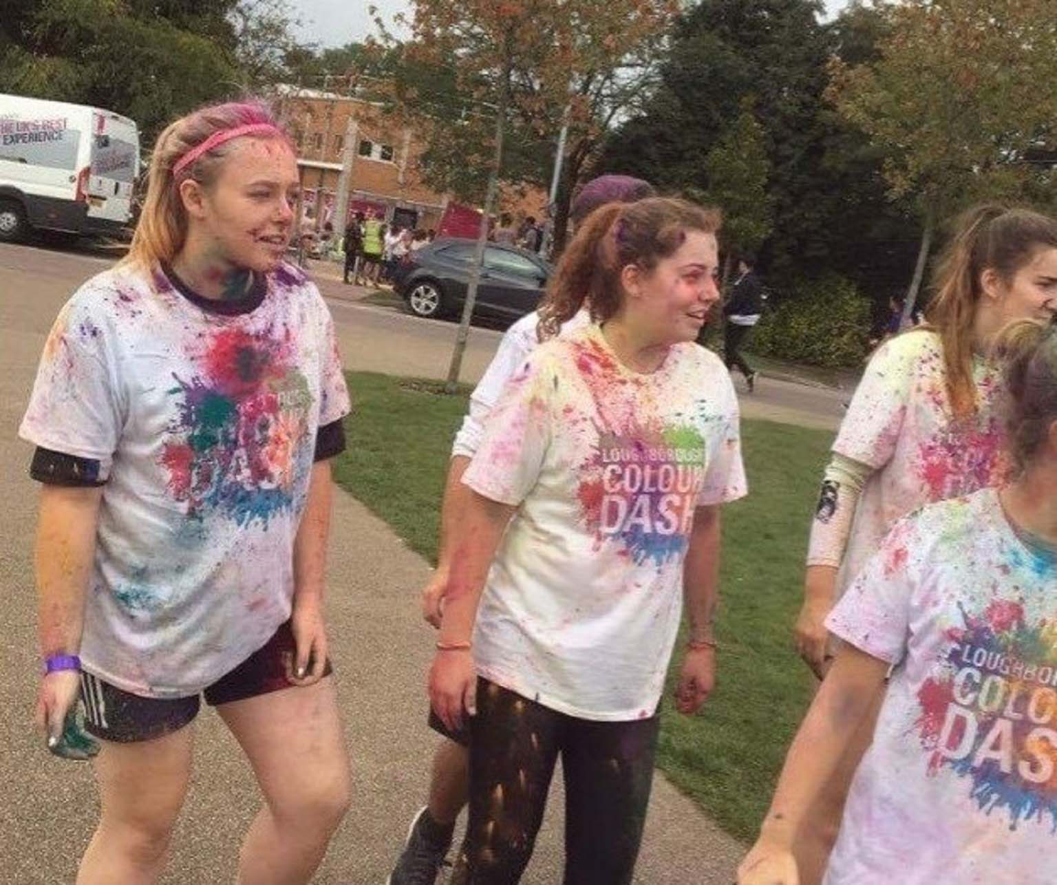 Becki and her friends after the 麻豆視頻_麻豆直播_麻豆传媒官网 colour dash. Becki's top is covered in multi-coloured paint that was thrown at her during the dash.  