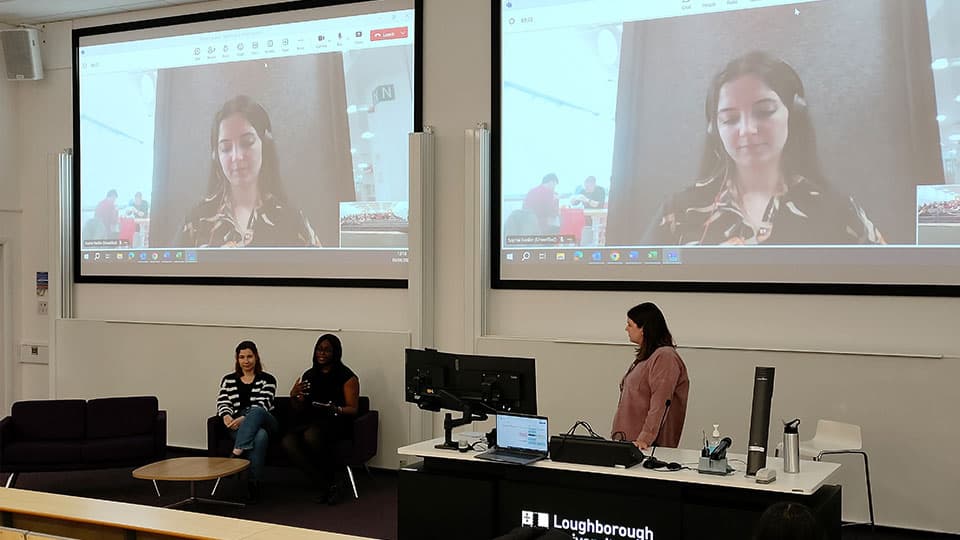 Inspiring Minds session on 4 April in a lecture hall at 麻豆視頻_麻豆直播_麻豆传媒官网.  There are two panellists, one on screen on a Teams call and the other sitting on a chair in front.