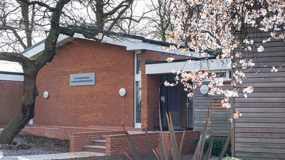 A red brick building with a sign that says International House